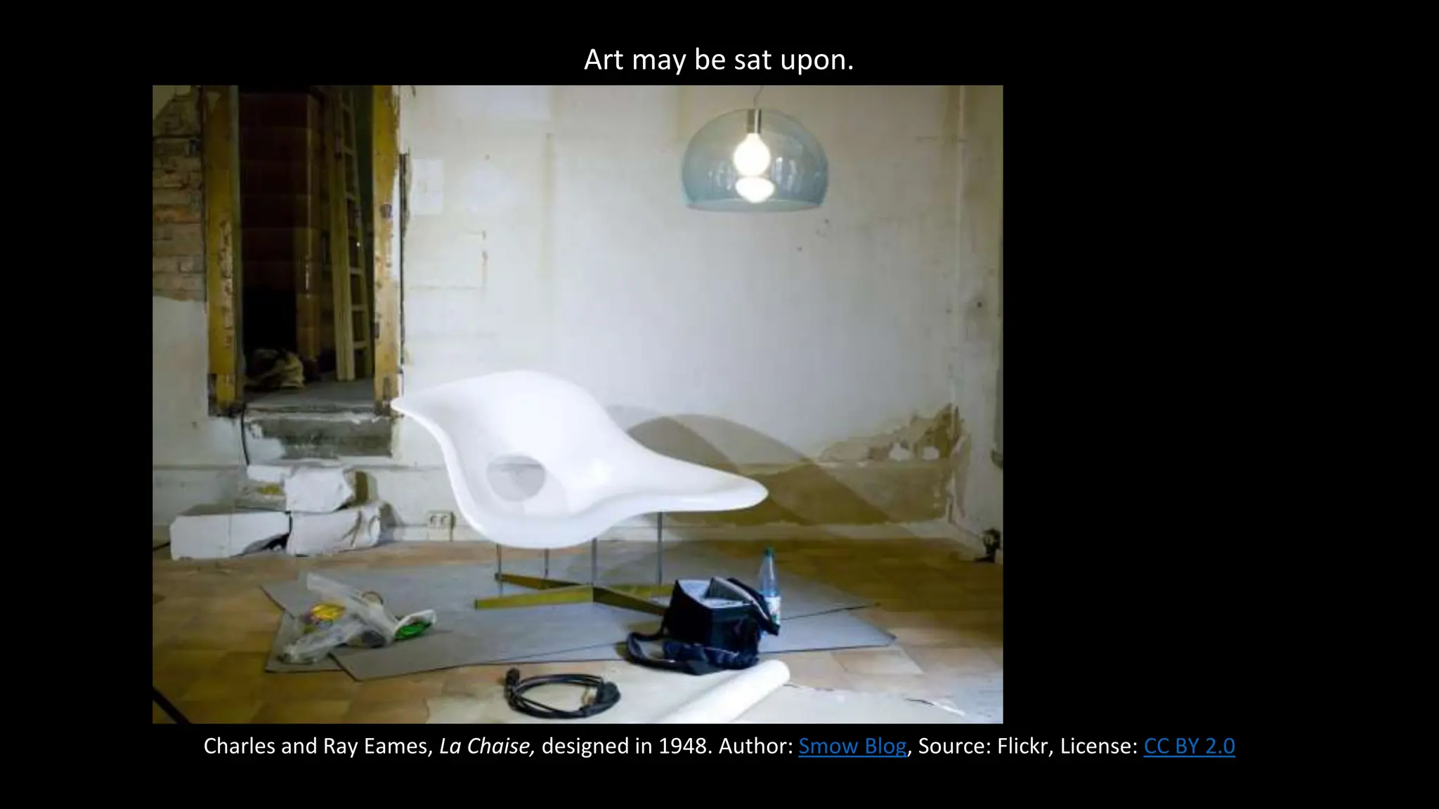 Art may be sat upon.
Charles and Ray Eames, La Chaise, designed in 1948. Author: Smow Blog, Source: Flickr, License: CC BY 2.0
 