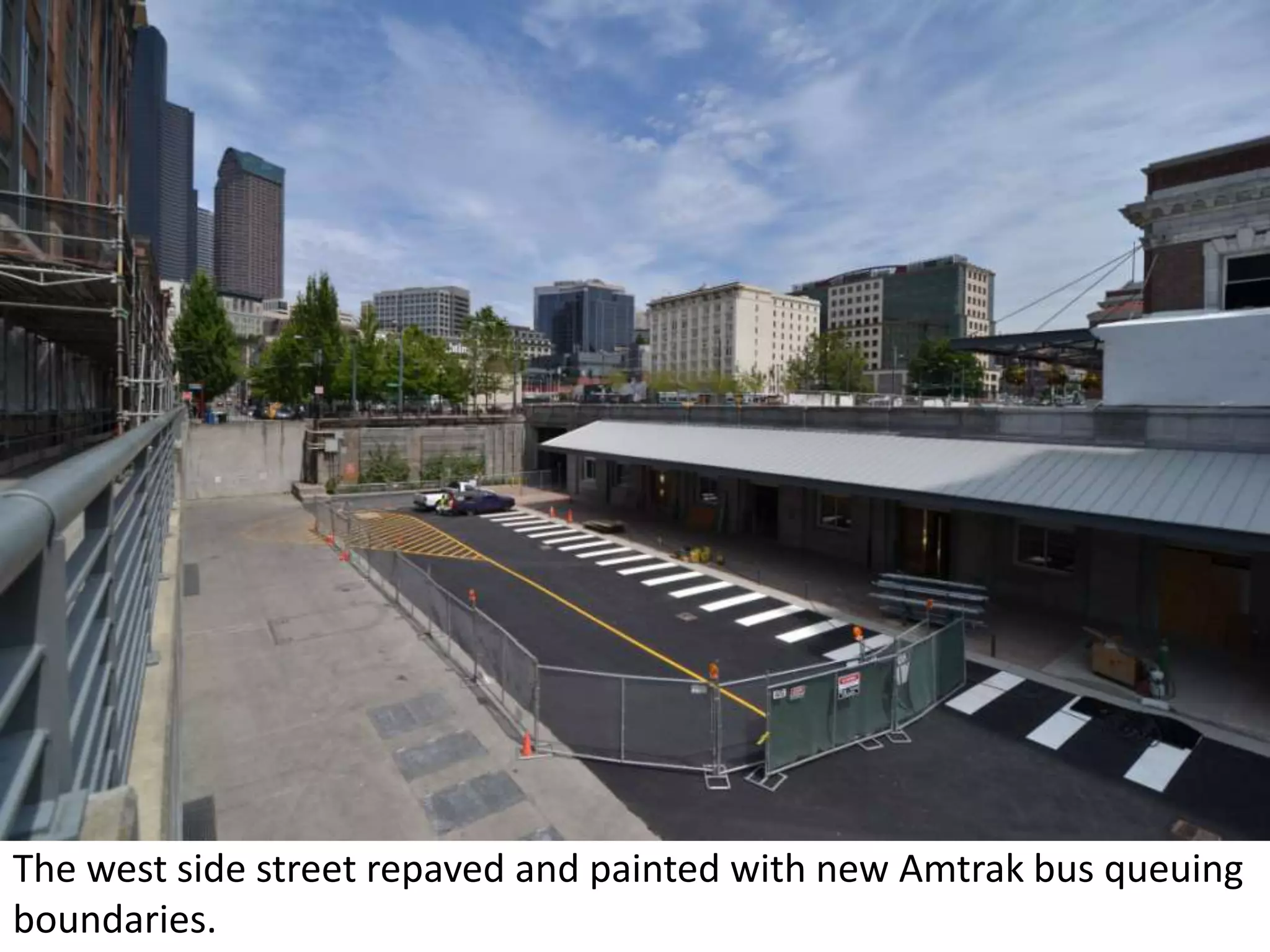 The west side street repaved and painted with new Amtrak bus queuing boundaries.