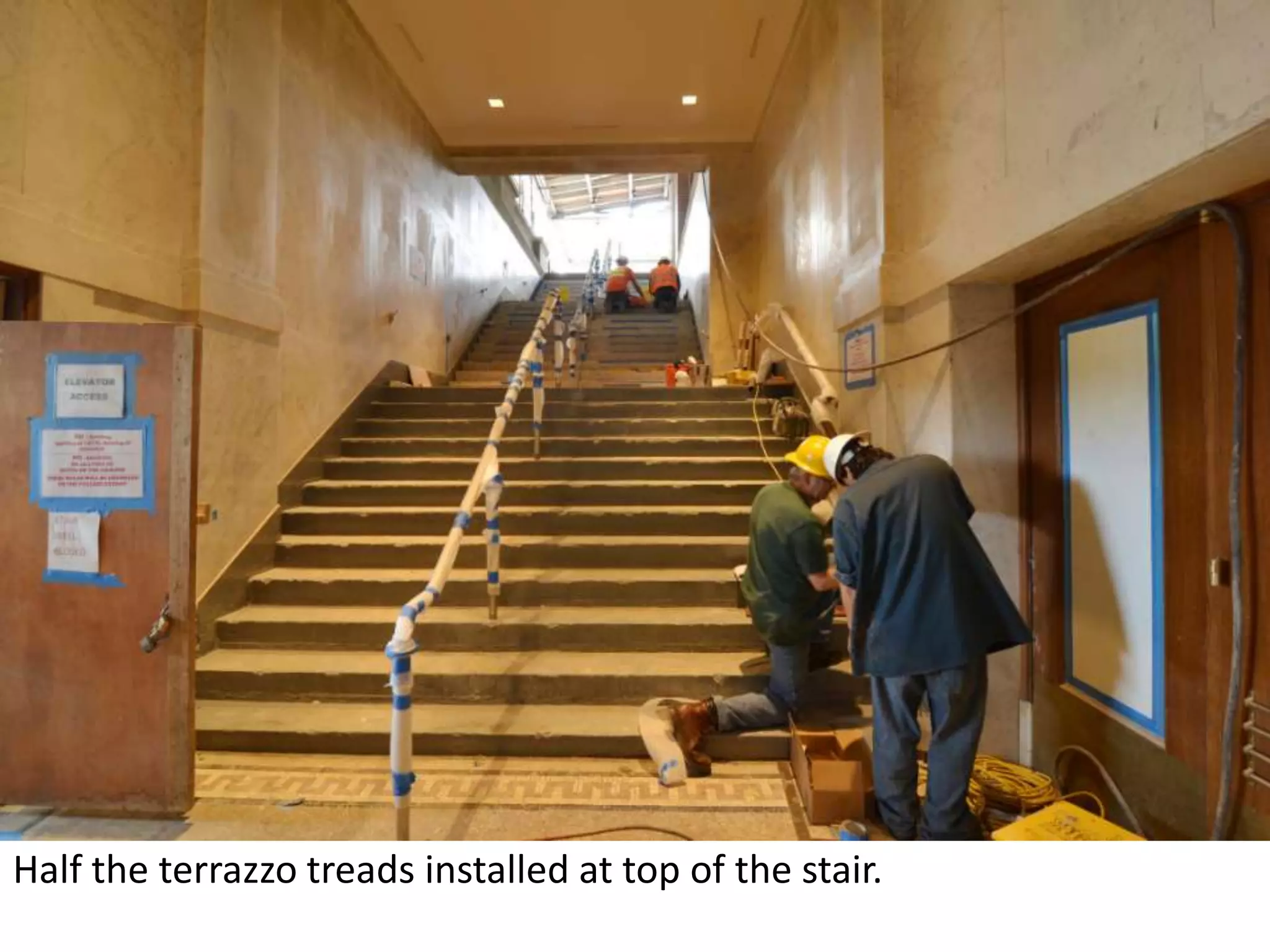Half the terrazzo treads installed at top of the stair.   