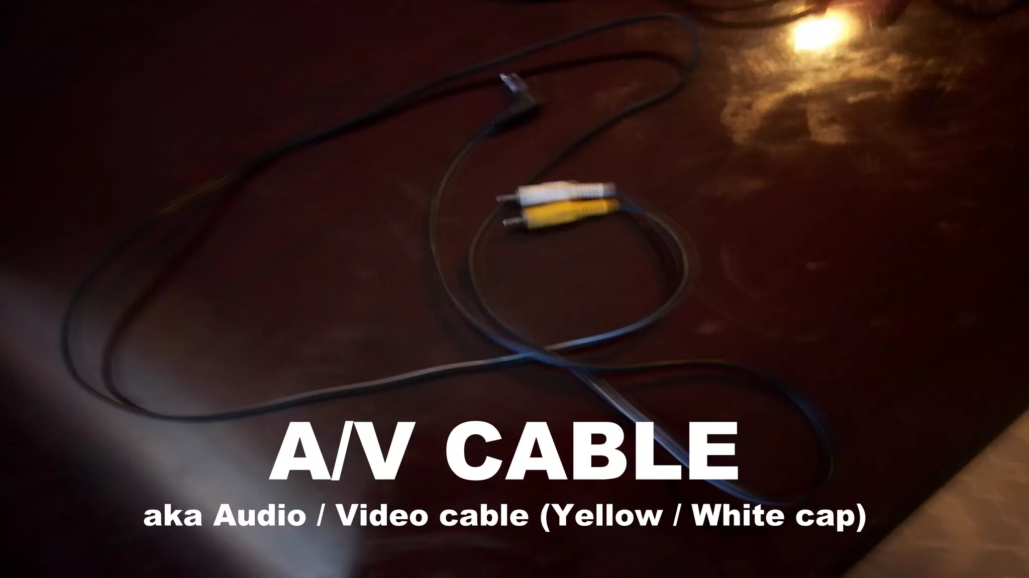 A/V CABLE
aka Audio / Video cable (Yellow / White cap)
 