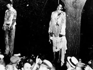 Strange Fruit Southern trees bear strange fruit, Blood on the leaves and blood at the root, Black bodies swinging in the southern breeze, Strange fruit hanging from the poplar trees. Pastoral scene of the gallant south, The bulging eyes and the twisted mouth, Scent of magnolias, sweet and fresh, Then the sudden smell of burning flesh. Here is fruit for the crows to pluck, For the rain to gather, for the wind to suck, For the sun to rot, for the trees to drop, Here is a strange and bitter crop.  