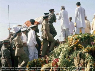 The body of Indian Prime Minister Pandit Jawaharal Nehru is carried by officers of the armed forces to a funeral pyre on the banks
of the Jumna River in New Delhi, India, on May 29, 1964, watched by thousands of mourners. (AP Photo)
 