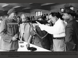 Top Chinese communist leader, Chairman of Communist Party (CCP) and President of the Republic, Mao Zedong examines a home-
made semi-automatic rifle during his visit to a military exhibition by the Beijing Units of the People's Liberation Army in June of 1964.
(AFP/Getty Images)
 