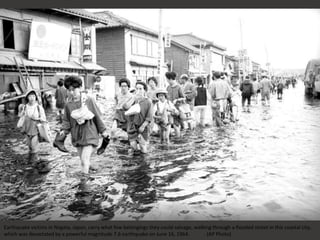 Earthquake victims in Niigata, Japan, carry what few belongings they could salvage, walking through a flooded street in this coastal city,
which was devastated by a powerful magnitude 7.6 earthquake on June 16, 1964. (AP Photo)
 