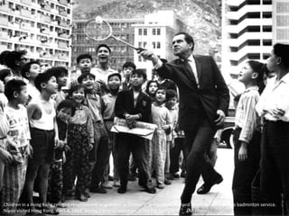 Children in a Hong Kong refugee resettlement area watch as former Vice President Richard Nixon shows them his badminton service.
Nixon visited Hong Kong, April 4, 1964, during a tour of countries in the Far East. (AP Photo)
 