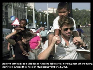 Brad Pitt carries his son Maddox as Angelina Jolie carries her daughter Zahara during
their stroll outside their hotel in Mumbai November 12, 2006.

 
