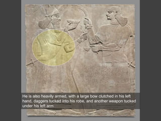 He is also heavily armed, with a large bow clutched in his left
hand, daggers tucked into his robe, and another weapon tucked
under his left arm
 