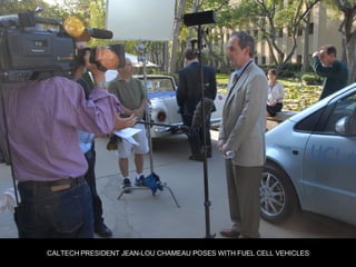 CALTECH PRESIDENT JEAN-LOU CHAMEAU POSES WITH FUEL CELL VEHICLES 