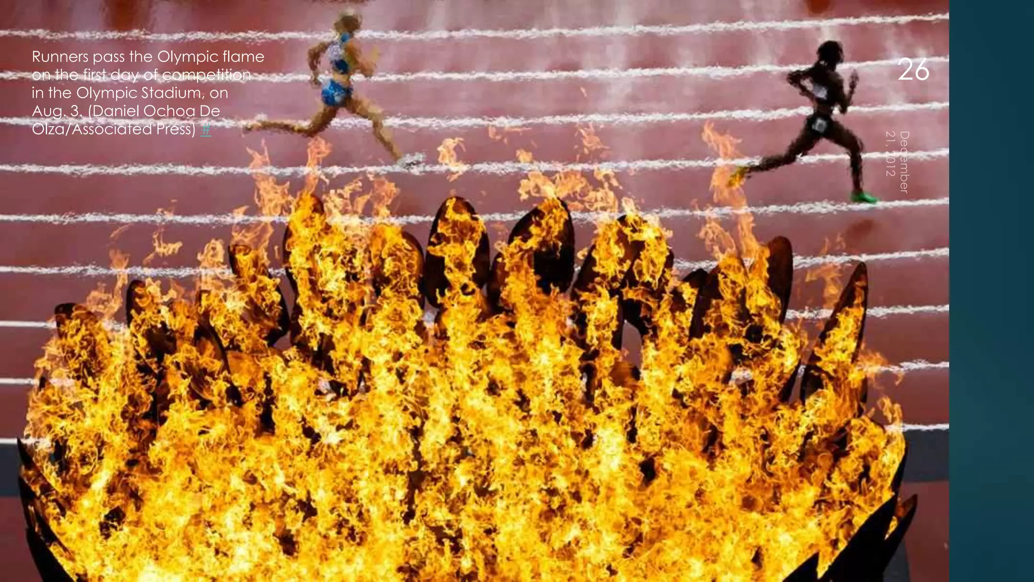 Runners pass the Olympic flame
on the first day of competition   26
in the Olympic Stadium, on
Aug. 3. (Daniel Ochoa De
Olza/Associated Press) #
 