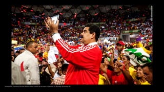 Venezuelan President Nicolas Maduro takes a selfie at an event in Caracas on Monday, November 30.
 