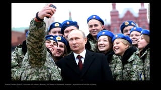 Russian President Vladimir Putin poses with cadets in Moscow's Red Square on Wednesday, November 4. It was National Unity ...