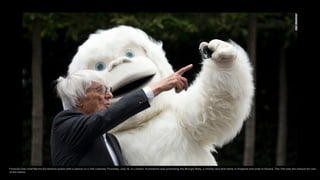 Formula One chief Bernie Ecclestone poses with a person in a Yeti costume Thursday, July 16, in London. Ecclestone was pro...