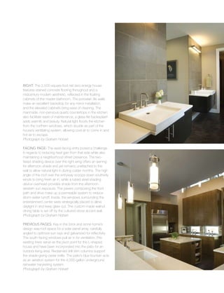 Sustainable
47
Right: The 2,500-square-foot net zero energy house
features stained concrete flooring throughout and a
midcentury modern aesthetic, reflected in the floating
cabinets of the master bathroom. The porcelain tile walls
make an excellent backdrop for any mirror installation,
and the elevated cabinets bring ease of cleaning. The
manmade, non-pervious quartz countertops in the kitchen
also facilitate ease of maintenance; a glass tile backsplash
adds warmth and beauty. Natural light floods the kitchen
from the northern windows, which double as part of the
house’s ventilating system, allowing cool air to come in and
hot air to escape.
Photograph by Graham Hobart
Facing Page: The west-facing entry posed a challenge
in regards to reducing heat gain from that side while also
maintaining a neighborhood street presence. The two-
tiered shading device over the right wing offers an awning
for afternoon shade and yet remains unattached to the
wall to allow natural light in during colder months. The high
angle of the roof over the entryway scoops down southerly
winds to bring fresh air in, while a tubed steel shading
device overhead provides shade from the afternoon
western sun exposure. The pavers composing the front
path and drive make up a permeable system to reduce
storm water runoff. Inside, the windows surrounding the
entertainment center were strategically placed to allow
daylight in and keep glare out. The custom-made walnut
dining table is set off by the cultured stone accent wall.
Photograph by Graham Hobart
Previous Pages: Key in the brick and stone home’s
design was roof space for a solar panel array, carefully
angled to optimize sun rays and galvanized for reflectivity.
The south-facing windows pull air in for ventilation. Pre-
existing trees serve as the pivot point for the L-shaped
house and have been incorporated into the patio for an
outdoor living area. Reclaimed drill stim columns support
the shade-giving cedar trellis. The patio’s blue fountain acts
as an aeration system for the 4,000-gallon underground
rainwater harvesting system.
Photograph by Graham Hobart
 