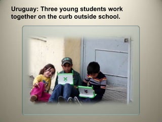 Uruguay: Three young students work
together on the curb outside school.
 