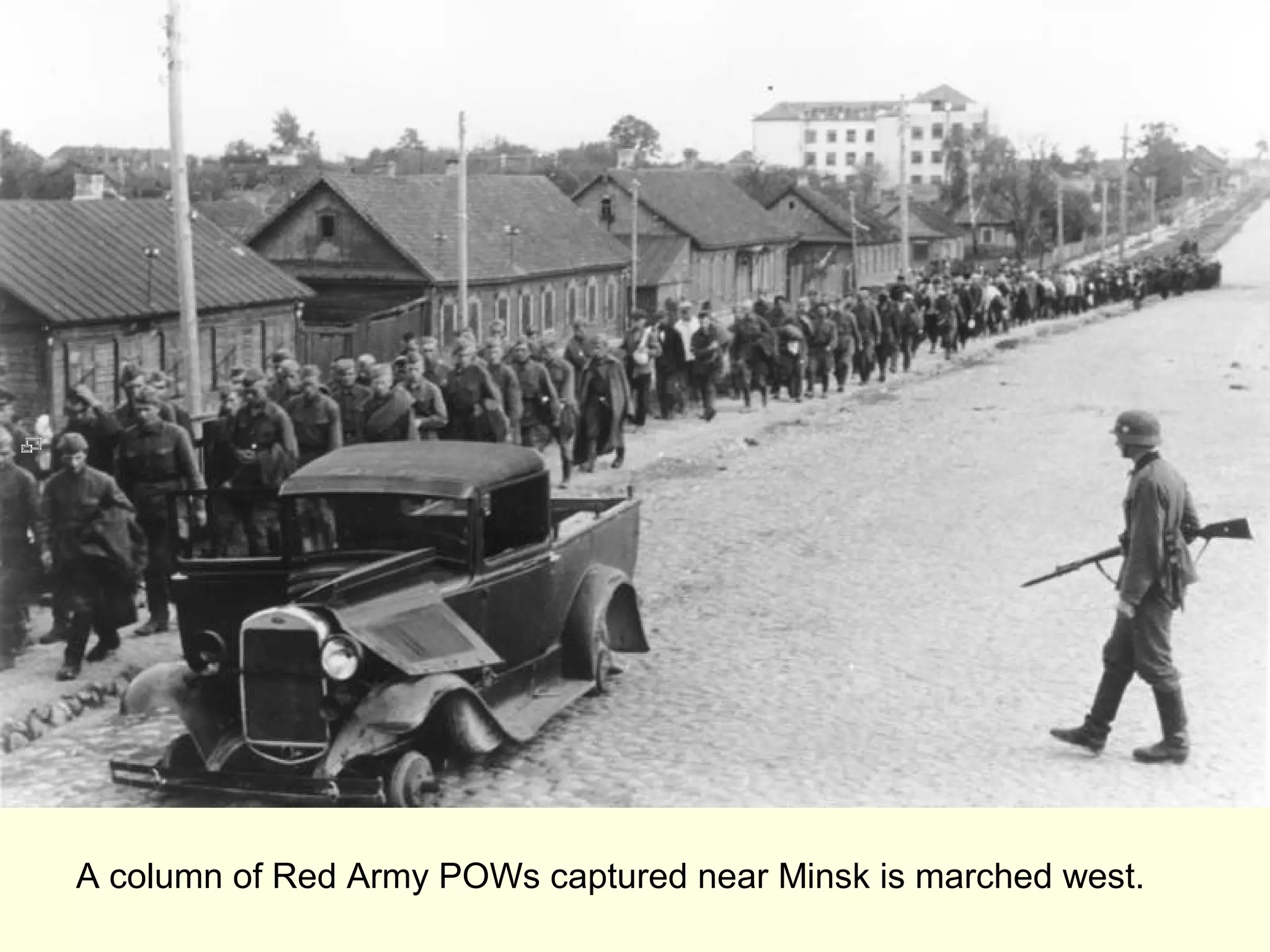A column of Red Army POWs captured near Minsk is marched west.
 