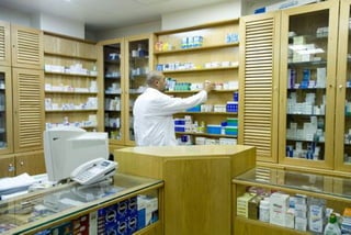 Pharmacist organizing the drugs