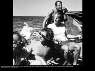 Spielberg (centre), producer Richard Zanuck (red shorts) and actor Roy Scheider (at rear) soak up the sun and ride the waves in between takes.
Photograph: Ronal Grant Archive
 