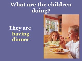 What are the children doing? They are  having dinner 