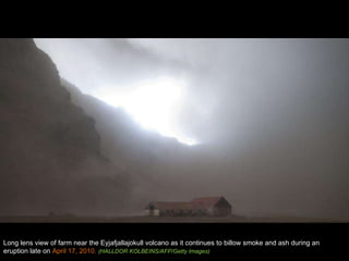 Long lens view of farm near the Eyjafjallajokull volcano as it continues to billow smoke and ash during an eruption late on  April 17, 2010.  (HALLDOR KOLBEINS/AFP/Getty Images) 