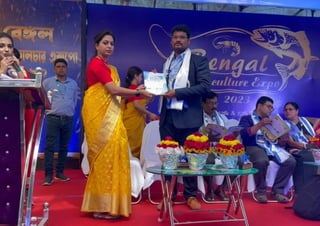 receiving certificate at west bengal expo