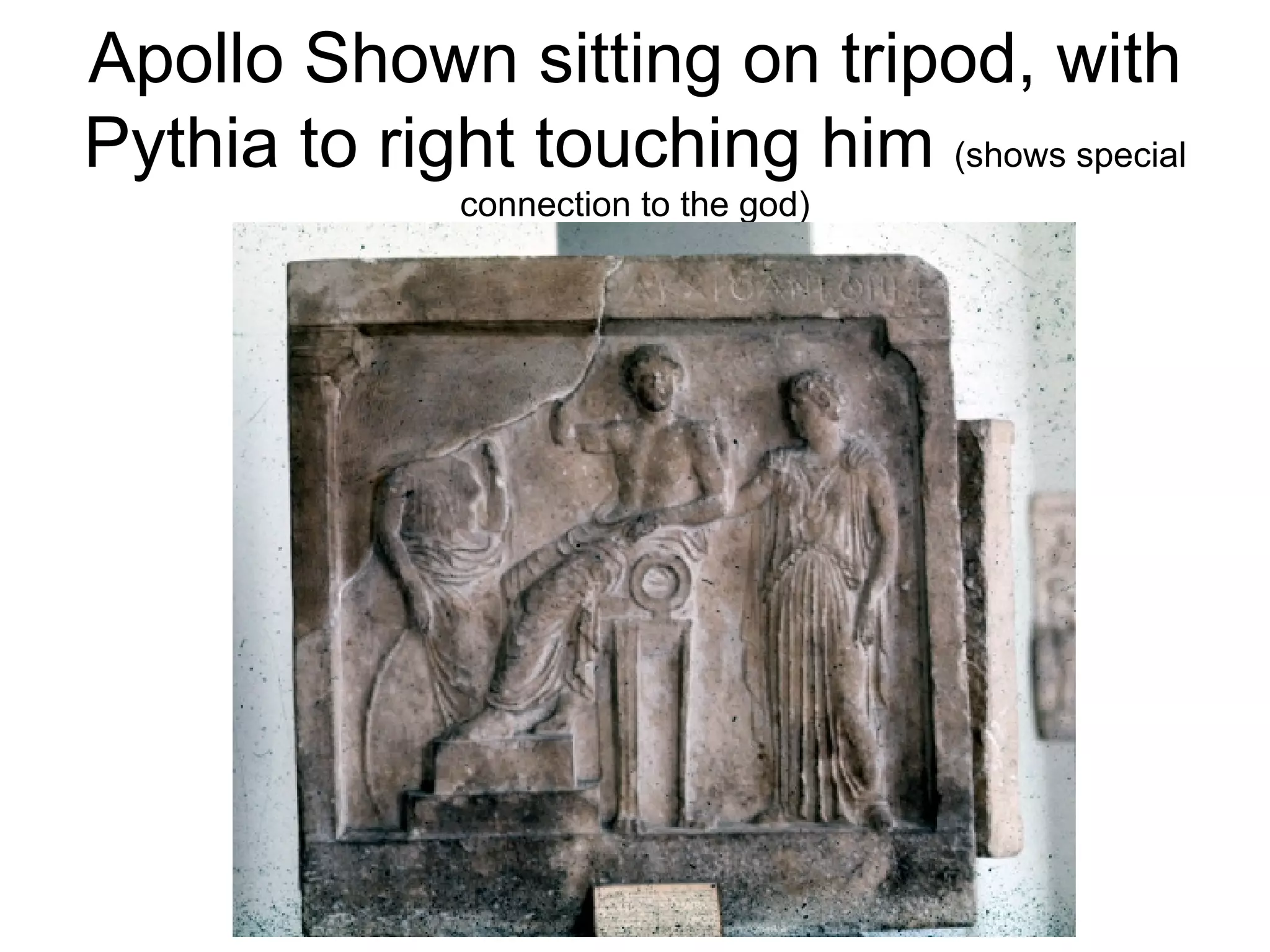 Apollo Shown sitting on tripod, with Pythia to right touching him  (shows special connection to the god) 