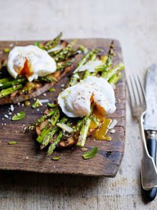 Preparing a delectable chicken and asparagus poached egg meal