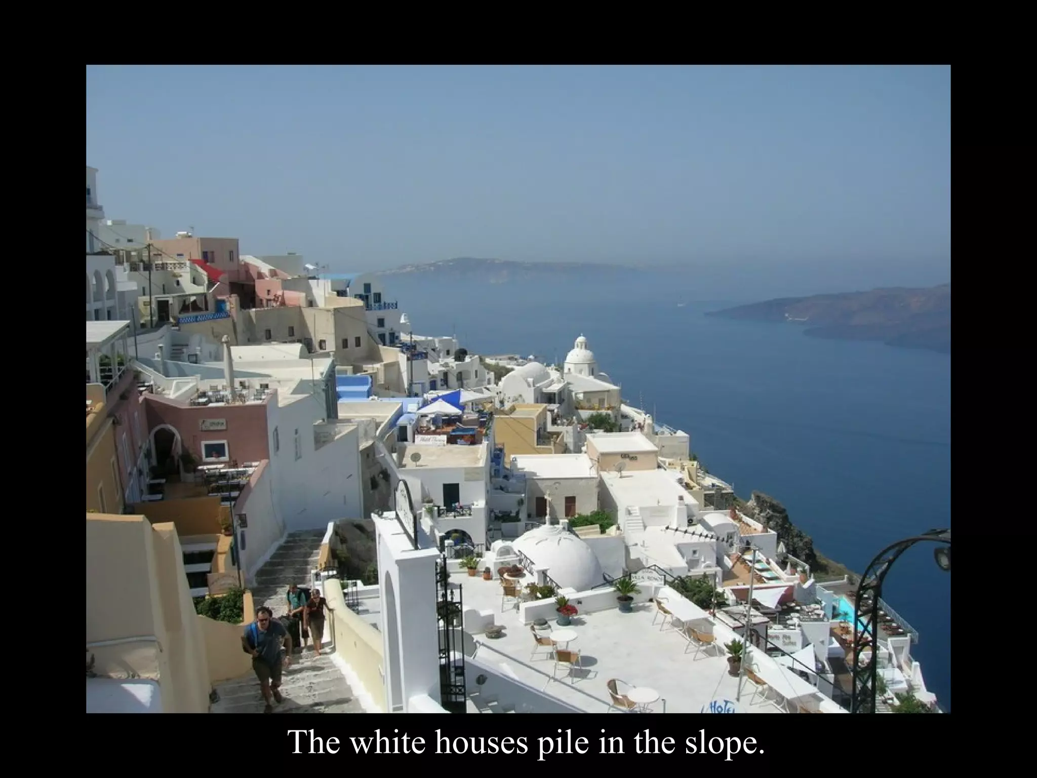 The white houses pile in the slope.
