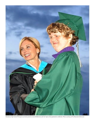 Ponderosa High School Principal Lisa Garret presents Corrie McNamara with her high school graduation certificate. Photo courtesy of The Mountain Democrat
 
