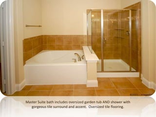 Master Suite bath includes oversized garden tub AND shower with gorgeous tile surround and accent.  Oversized tile flooring.