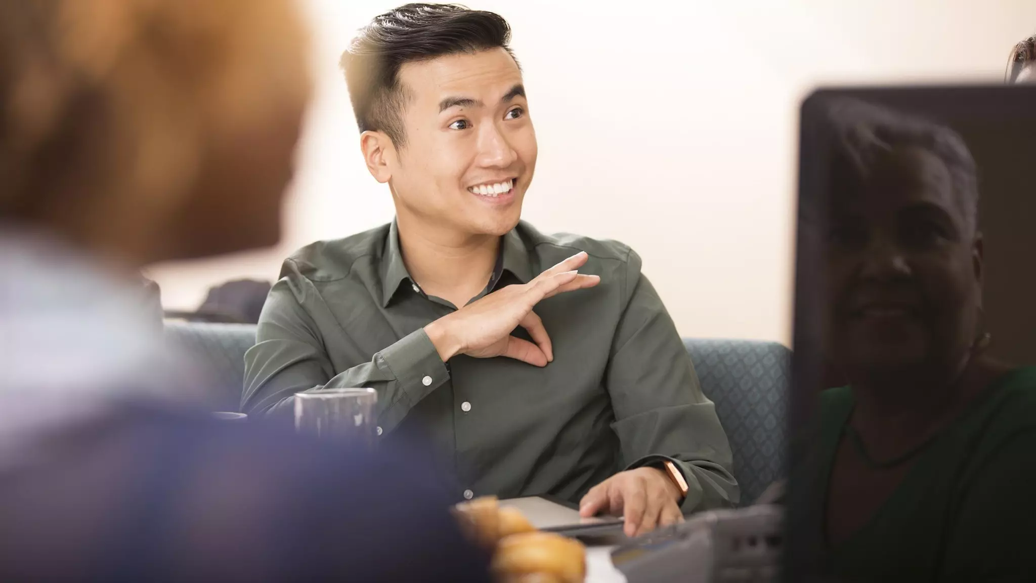 Using sign language to communicate.
 