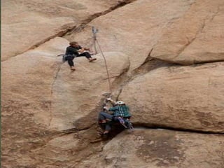 Rock climbing is an activity in which participants climb up,
down or across natural rock formations or artificial rock
walls. The goal is to reach the summit of a formation or the
endpoint of a pre-defined route without falling. Rock
climbing competitions have objectives of completing the
route in the quickest possible time or the farthest along an
increasingly difficult route. Rock climbing is similar to
scrambling (another activity involving the scaling of hills and
similar formations), but climbing is generally differentiated
by its sustained use of hands to support the climber's weight
as well as to provide balance.
 