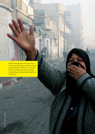 A Palestinian woman covers her face as
                             smoke rises following an explosion during
                             an Israeli strike in Gaza city, 14 January
                             2009. The strike was part of a 22-day
                             military offensive code-named Operation
                             “Cast Lead”.
© AP/PA Photo/Khalil Hamra
 