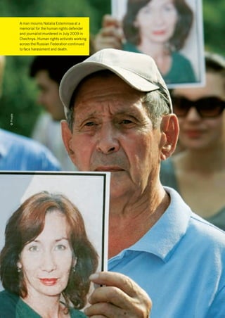 A man mourns Natalia Estemirova at a
            memorial for the human rights defender
            and journalist murdered in July 2009 in
            Chechnya. Human rights activists working
            across the Russian Federation continued
            to face harassment and death.
© Private
 