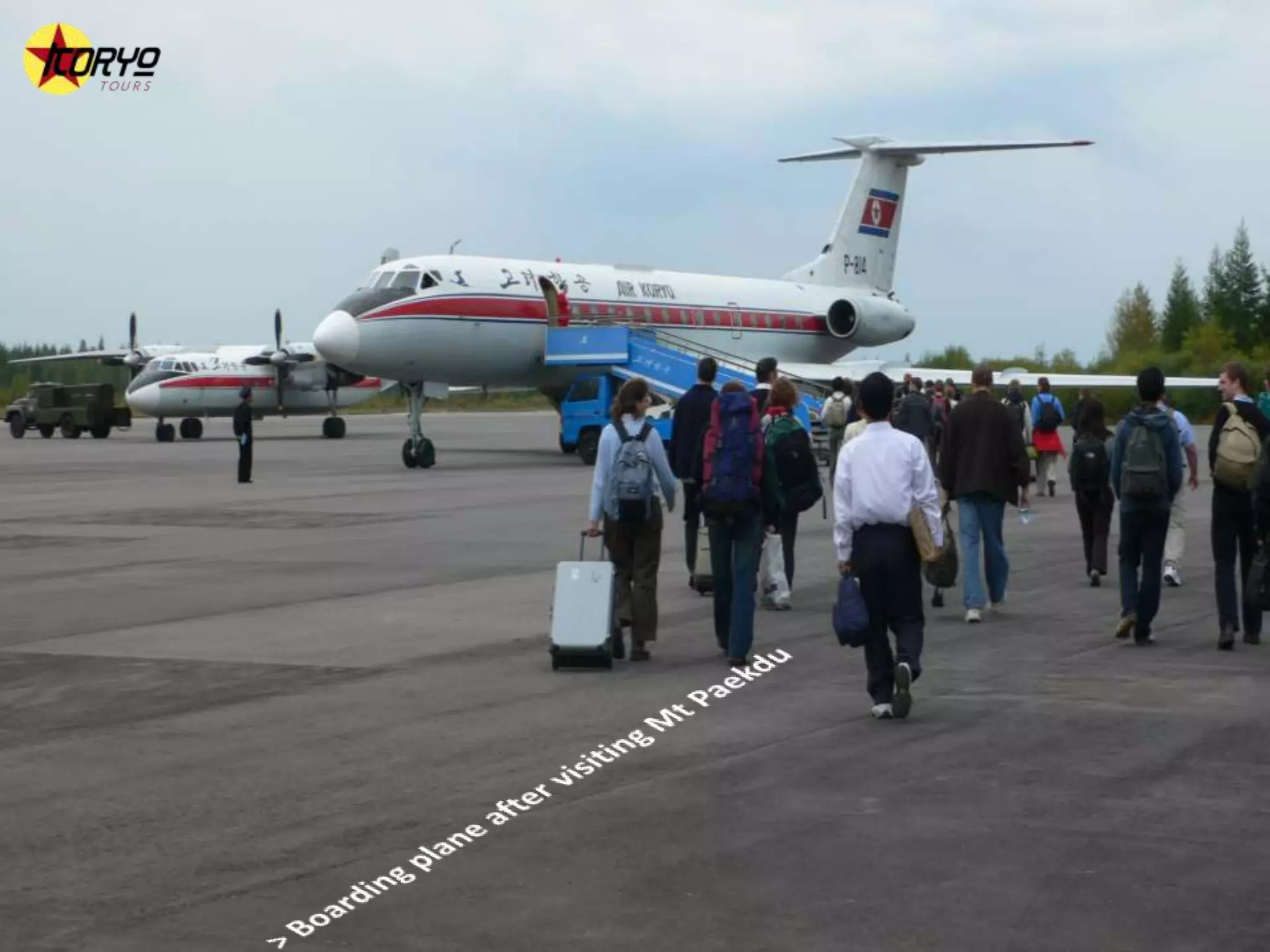 > Boarding plane after visiting Mt Paekdu