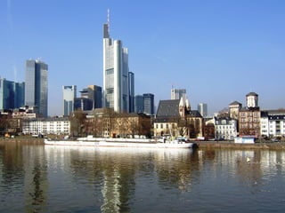 Illustration of a cityscape with music notes floating over Frankfurt skyline in 2025