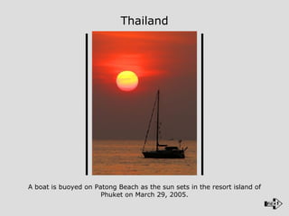 A boat is buoyed on Patong Beach as the sun sets in the resort island of Phuket on March 29, 2005. Thailand 
