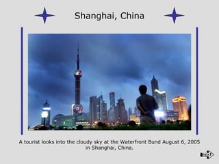 A tourist looks into the cloudy sky at the Waterfront Bund August 6, 2005 in Shanghai, China. Shanghai, China 