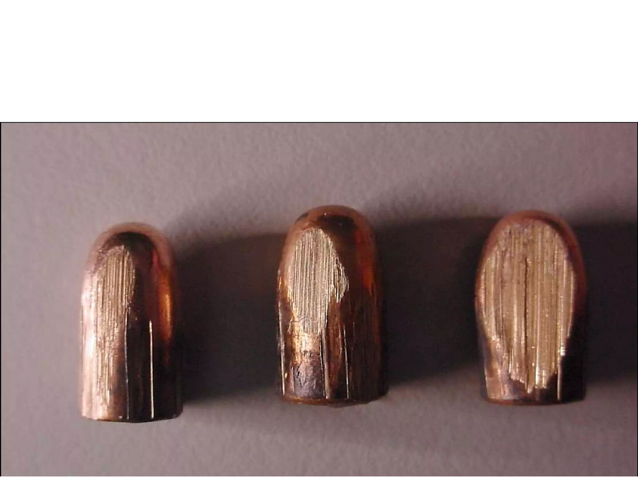 Three 50-gr. FMJ .25 Automatic Bullets Ricocheted from a Hard, Unyielding Surface after Low (less that 5 0 ) Incident Angle Impacts   