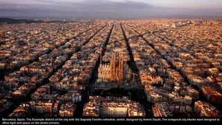Barcelona, Spain. The Eixample district of the city with the Sagrada Familia cathedral, centre, designed by Antoni Gaudí. The octagonal city blocks were designed to
allow light and space on the street corners.
 