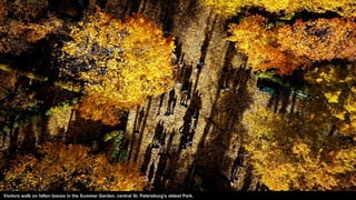 Visitors walk on fallen leaves in the Summer Garden, central St. Petersburg's oldest Park.
 
