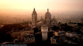 Paris, France Sacré-Cœur glowing in a hazy sunrise.
 