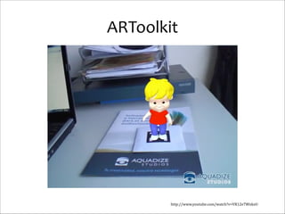 ARToolkit

http://www.youtube.com/watch?v=VR12e7WnkxU

 