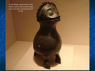 A late Shang, ritual bronze wine
vessel (zun) in the unusual shape
of an owl with a domed head for
its lid
 