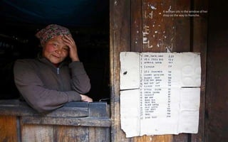 A woman sits in the window of her
shop on the way to Namche.
 