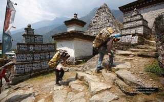 Kedar Rai and his sons
carry goods to their shop
in Solukhumbu District.
 