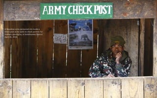 A Nepalese army personnel sits inside a
check post as he waits to check permits for
trekkers passing by, in Solukhumbu District
April 26, 2014.
 