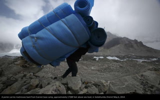 A porter carries mattresses back from Everest base camp, approximately 17388 feet above sea level, in Solukhumbu District May 6, 2014.
 