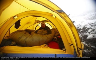 Phurba Tenzing Sherpa, 24, who has reached the summit of Everest nine times, sits inside his tent at Everest Base camp, approximately 17388 feet above sea level in
Solukhumbu District May 6, 2014.
 