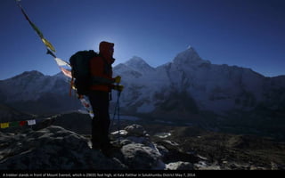 A trekker stands in front of Mount Everest, which is 29035 feet high, at Kala Patthar in Solukhumbu District May 7, 2014.
 