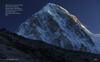 Light from a sunrise illuminates
Mount Pumori, which is
approximately 23294 high, as
trekkers look at the mountains
from Kala Patthar in
Solukhumbu District May 7,
2014.
 